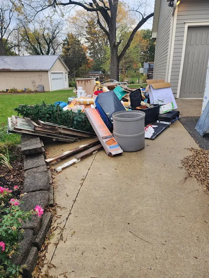 Dumpster being loaded with debris for Demolition Dumpster Rental in Brookline